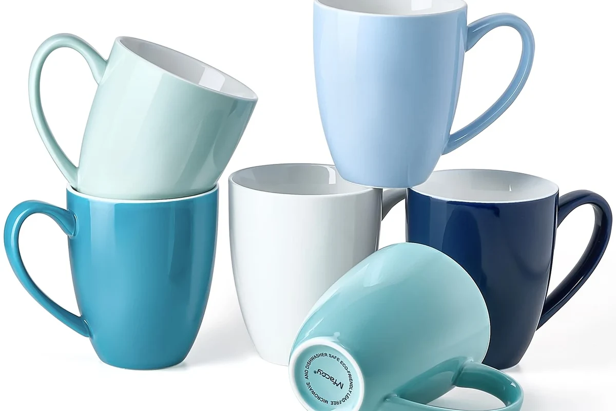 Porcelain coffee mug holding hot coffee on a kitchen counter