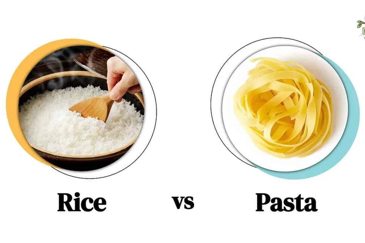 Bowl of rice and plate of pasta with vegetables in a bright home kitchen