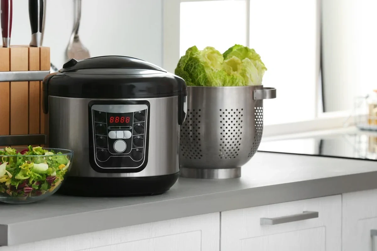 Slow cooker pasta with sauce and penne in a kitchen pot