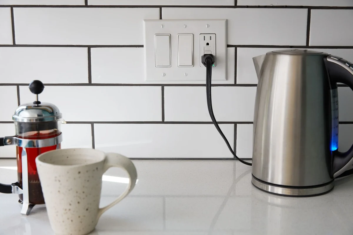 Modern kitchen countertop toaster near a grounded outlet with safe clearance from sink and cabinets