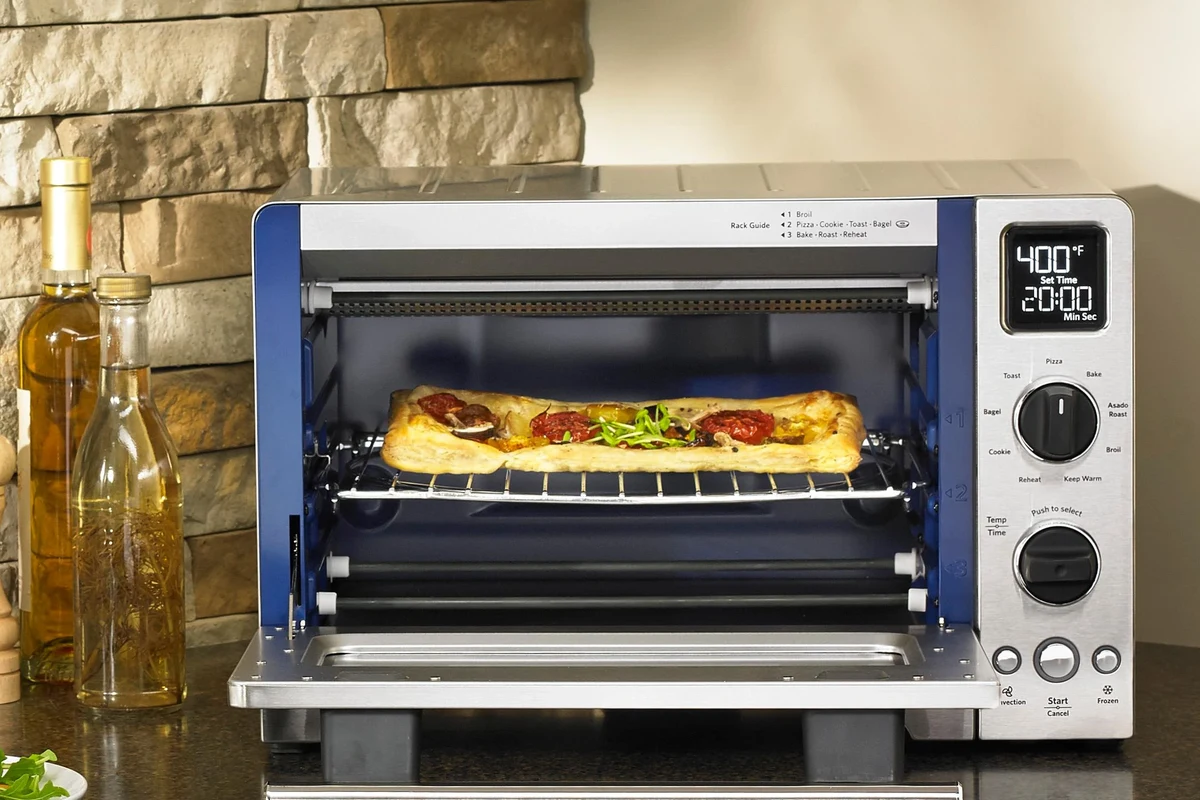 Modern kitchen countertop toaster near a grounded outlet with safe clearance from sink and cabinets