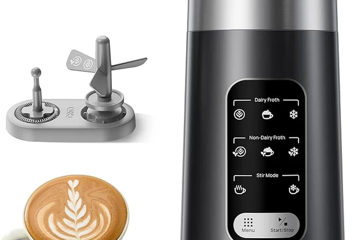 Electric milk frother making smooth milk foam for simple latte art in a home kitchen